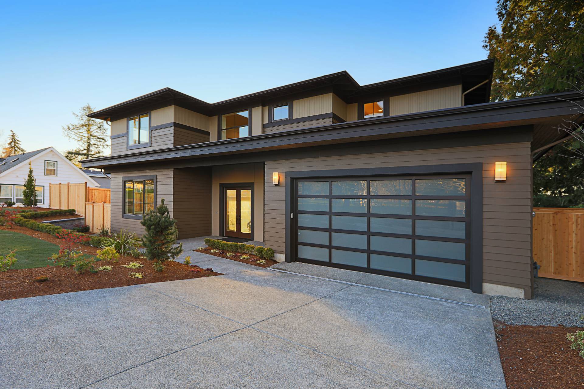 Two-story home with gutters along the roofline and coordinated exterior trim